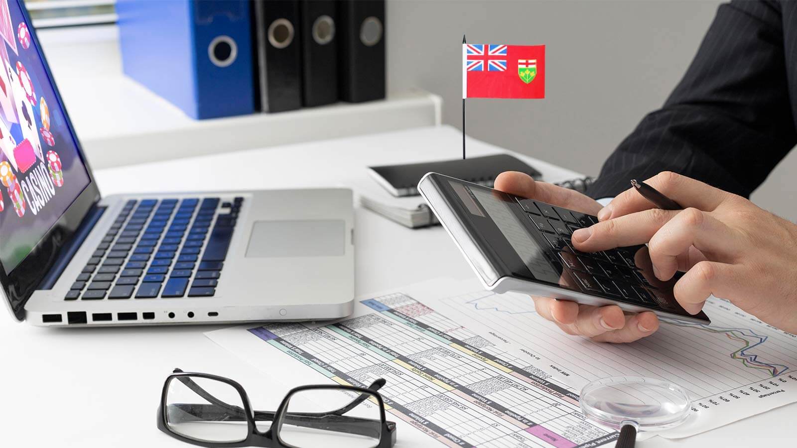 Man calculating taxes for betting winnings in Ontario