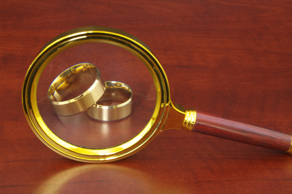 Magnifying glass with wedding rings