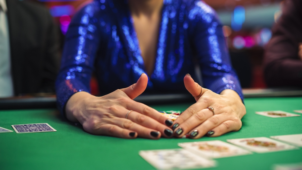 Woman winning hand of cards