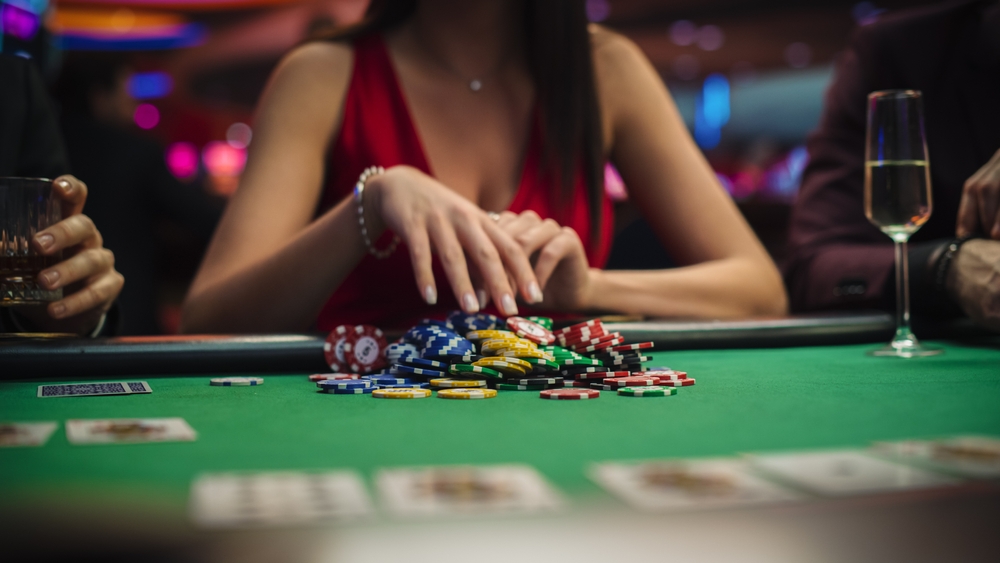 Glamorous woman playing poker