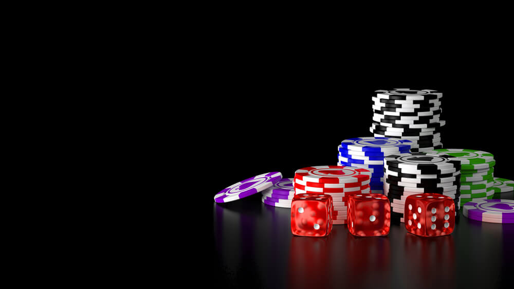 three dice with casino chips