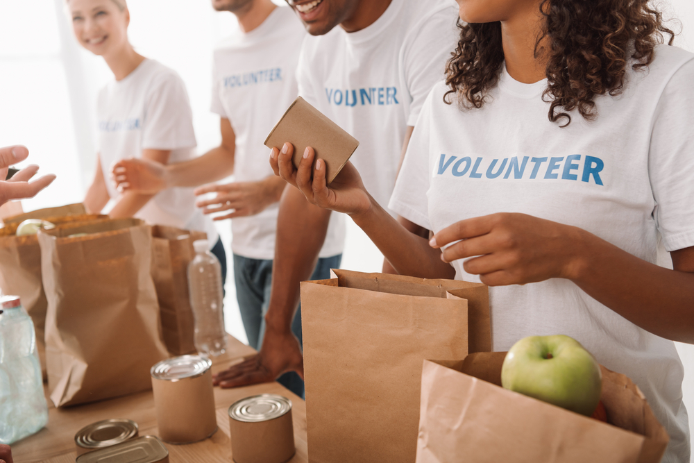 volunteers pack food donations