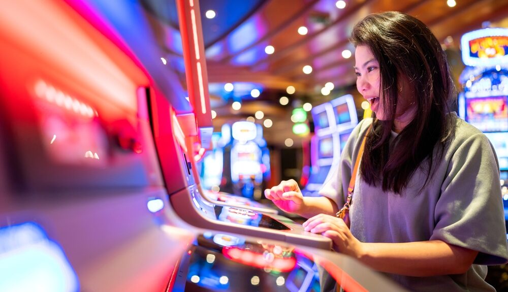 Excited woman plays slots